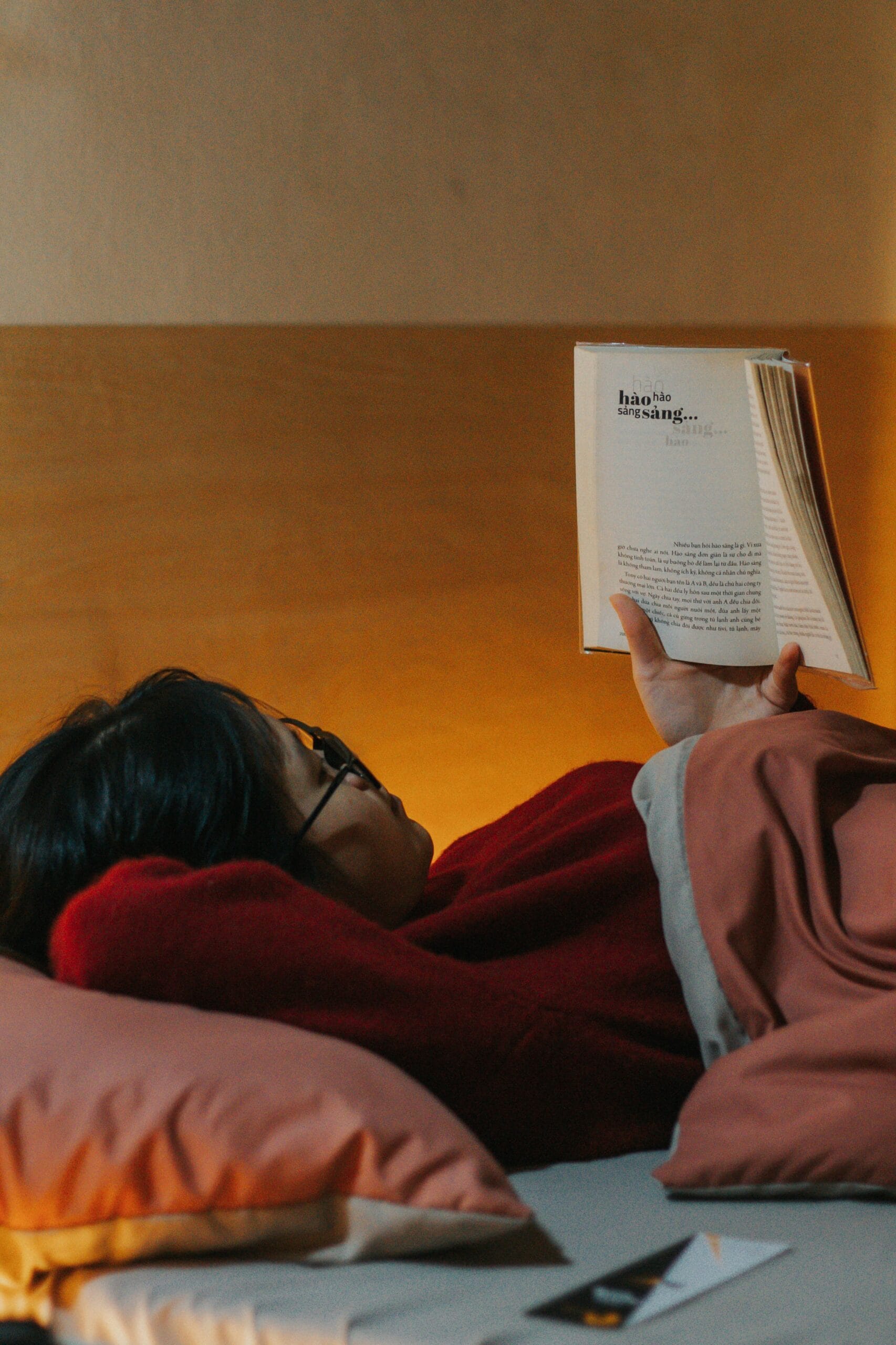Reading in bed to get out of a reading slump.